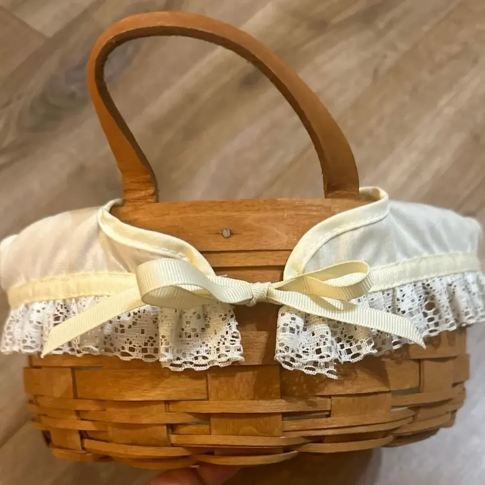 Longaberger Round Basket 10”with leather handles lace trim liner 1990 signed.